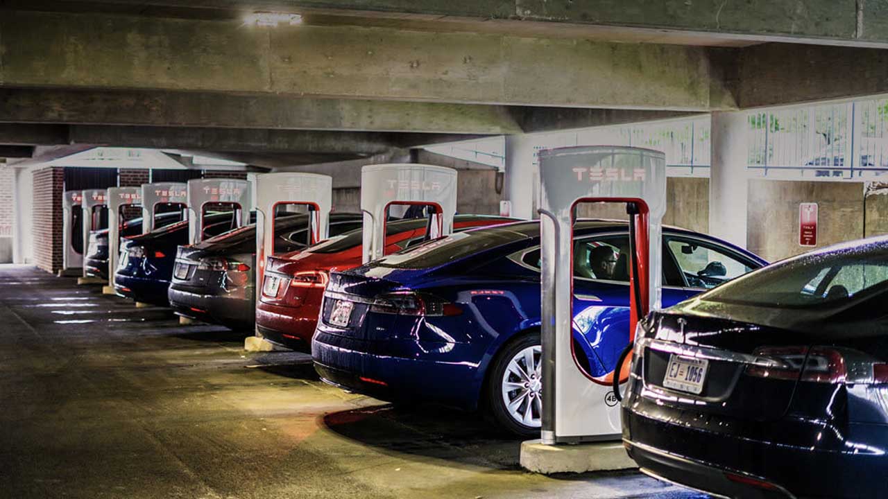 Tesla cars charging supercharger station