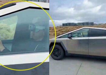 man wearing apple vision pro drives Tesla cybertruck